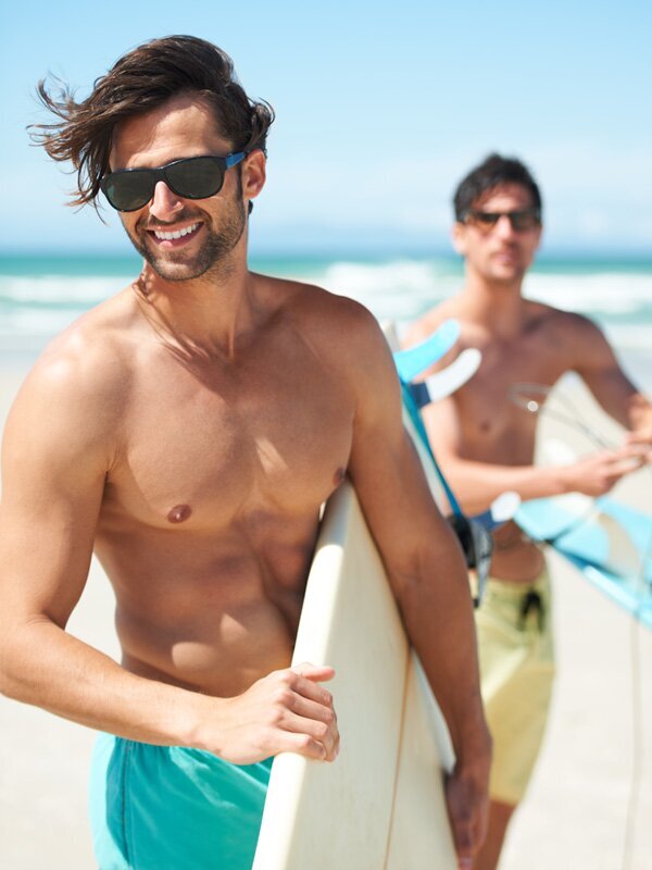 Grand Rapids Tummy Tuck for Men models with surfboards