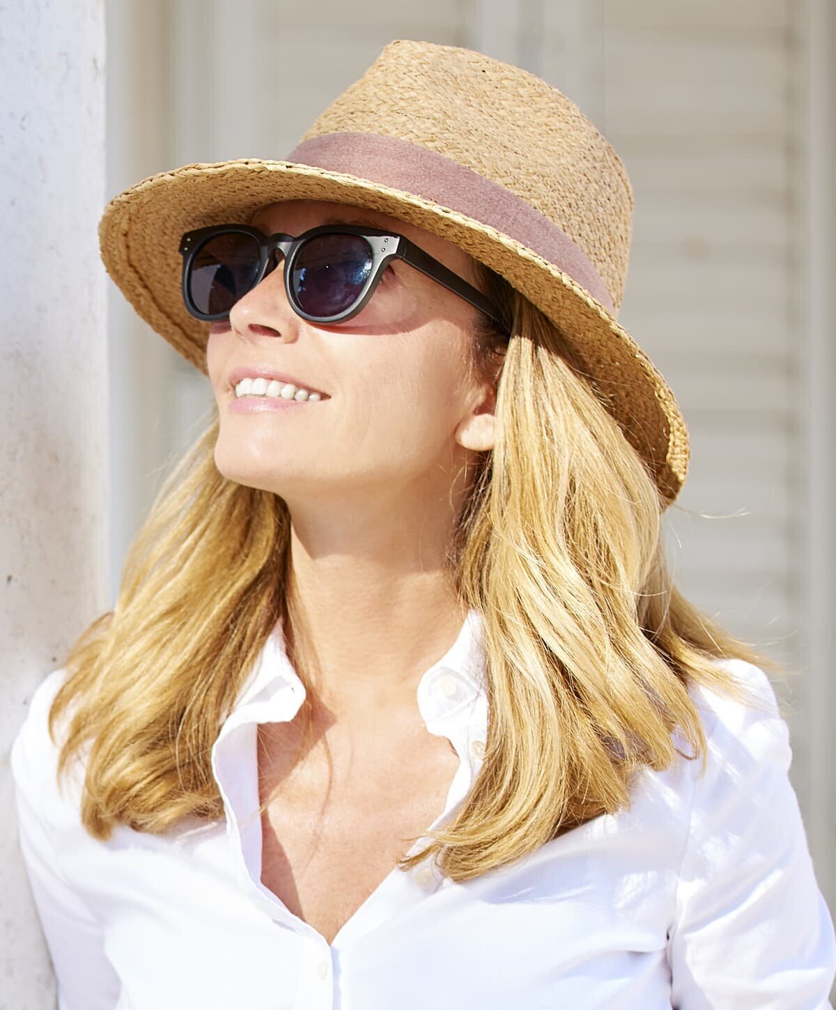 Age Spots Treatment patient model wearing a sunhat and white shirt
